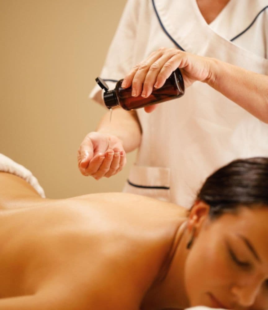 Therapist giving a back massage